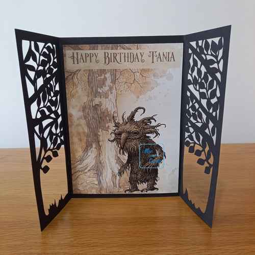 tree gatefold card with a forest creature inside