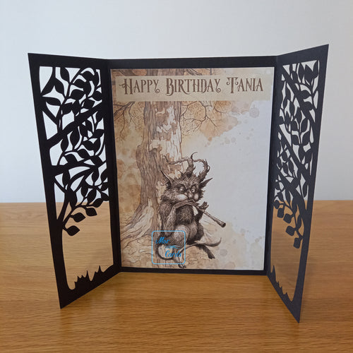 tree gatefold card with pipes playing forest creature and a tree