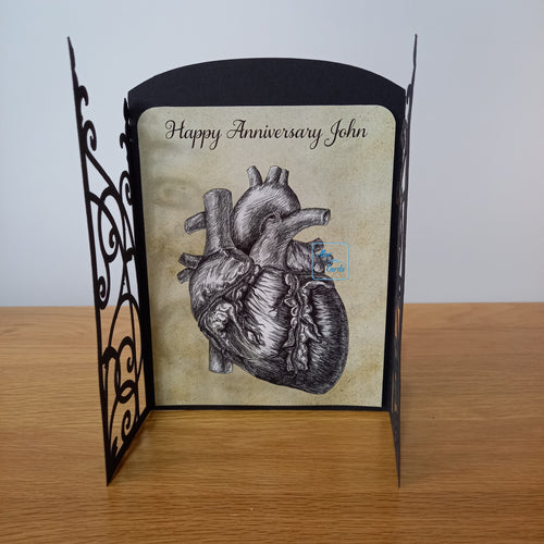 Ornate gatefold card with anatomical heart print inside