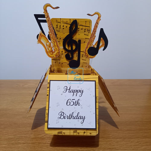 pop up box card with music notes and saxophones