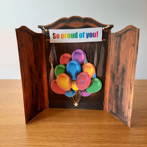 wardrobe closet card with a bunch of rainbow balloons and a personalised banner